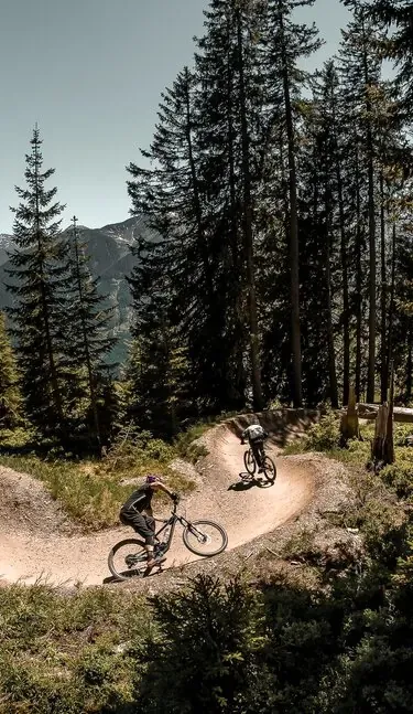 Rider on a bike park flow trail