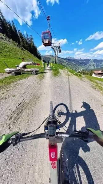 Gravel road climbing to an alpine hut